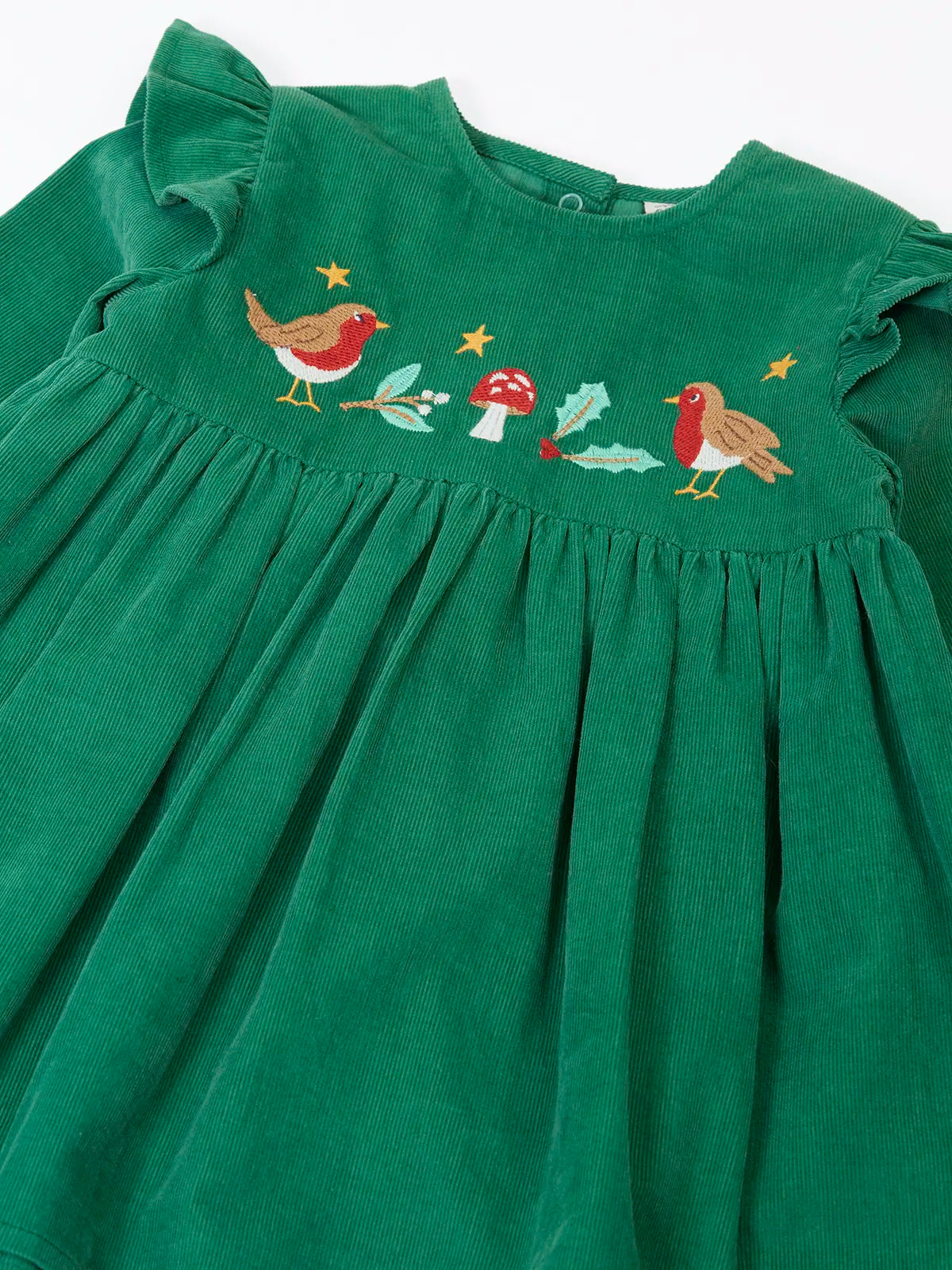 Close up of the robin, mistltoe, holly and toadstool festive details on the front of the Frugi organic cotton maud holly green corduroy dress.