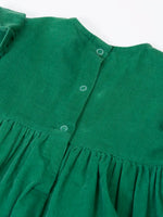 Close up of the popper closure on the back of the Frugi organic cotton maud holly green corduroy dress.