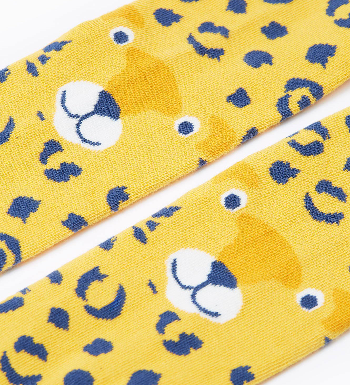 A close up of the leopard face on the knees of the Frugi Organic Cotton Norah Leopard Knitted Tights. These tights are part of a wide range of organic cotton clothing for children available here at Babipur. 