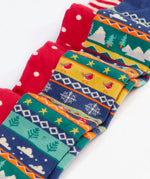 Close up of the Frugi organic cotton norah tights 2 pack. One scarlet red with spots on the lower half and stripes on the top. One Fair Isle pair with festive details.