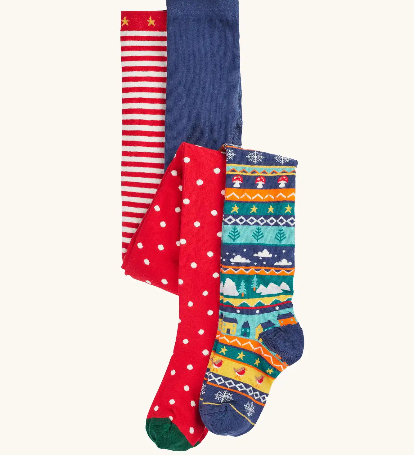 Frugi organic cotton norah tights 2 pack. One scarlet red with spots on the lower half and stripes on the top. One Fair Isle pair with festive details.