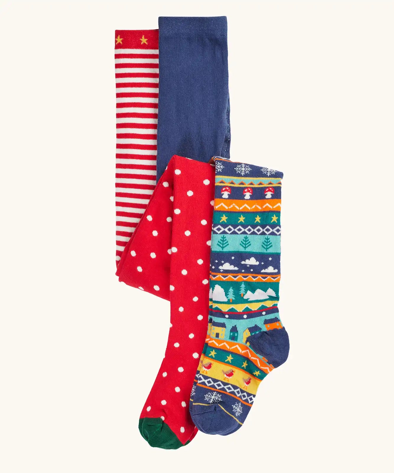 Frugi organic cotton norah tights 2 pack. One scarlet red with spots on the lower half and stripes on the top. One Fair Isle pair with festive details.