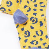A close up of the primrose prurple colour block heel caps on the knees of the Frugi Organic Cotton Norah Leopard Knitted Tights. These tights are part of a wide range of organic cotton clothing for children available here at Babipur. 