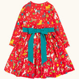 Back of the Frugi organic cotton pink party skater dress in a pet paw-ty print with a detachable teal bow. 
