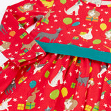 Close up of the front of the Back of the Frugi organic cotton pink party skater dress in a pet paw-ty print with a teal waist band.