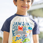  and navy short sleeves. On a cream background