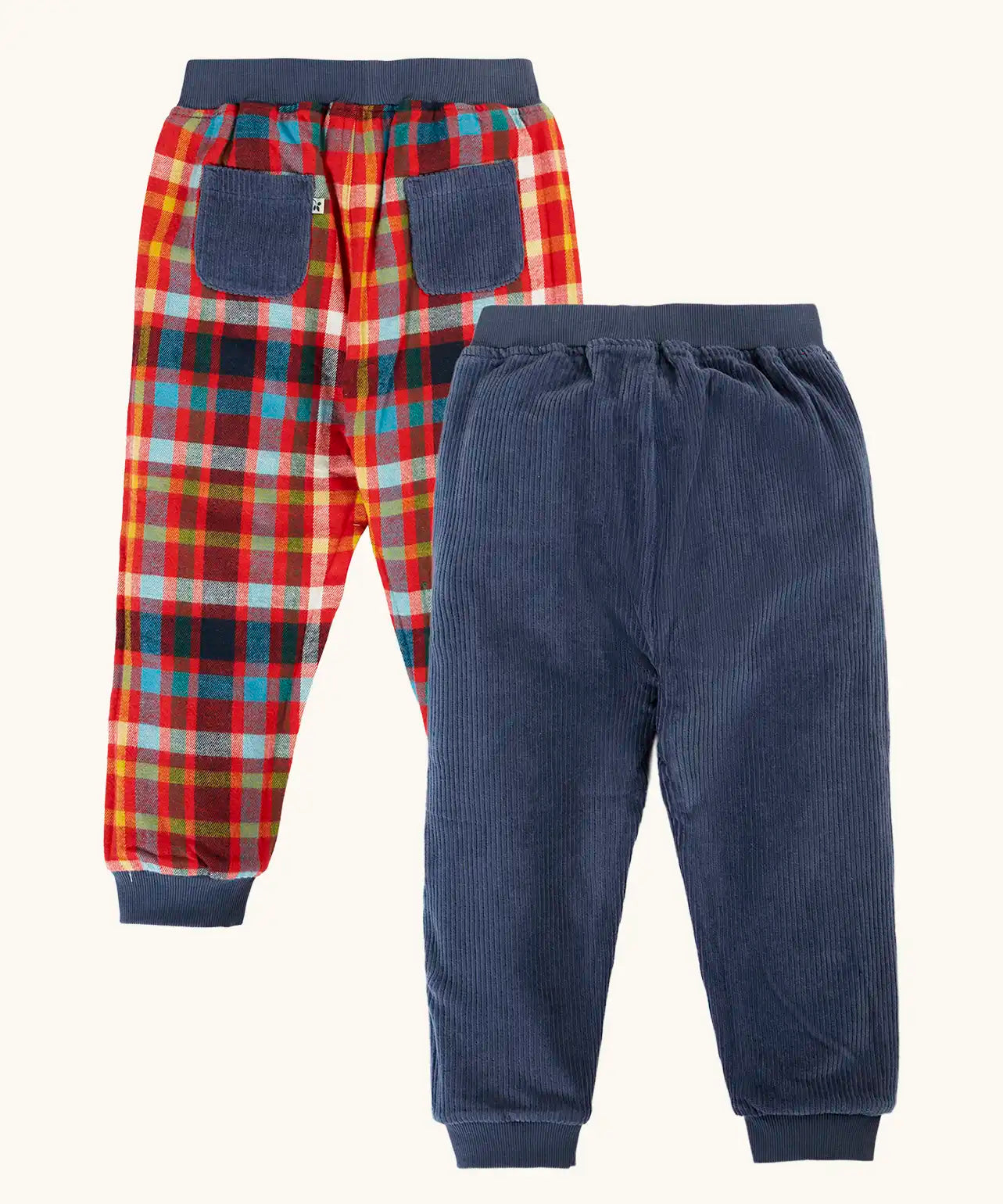 Frugi organic cotton ronnie reversible pull up trousers, festive check on one side and navy corduroy on the other. 