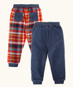 Frugi organic cotton ronnie reversible pull up trousers, festive check on one side and navy corduroy on the other. 
