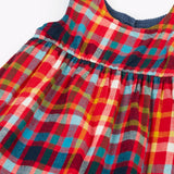 Frugi organic cotton rosalie reversible dress, on the festive multicoloured check side.