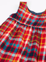 Frugi organic cotton rosalie reversible dress, on the festive multicoloured check side.