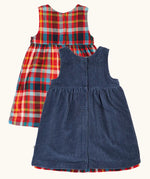 Back of the Frugi organic cotton rosalie reversible dress, one side in navy corduroy, one side in festive multicoloured check  popper closures down the middle.