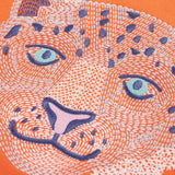 Close up of the embroidered snow leopard Frugi organic cotton salamander orange long sleeve top.