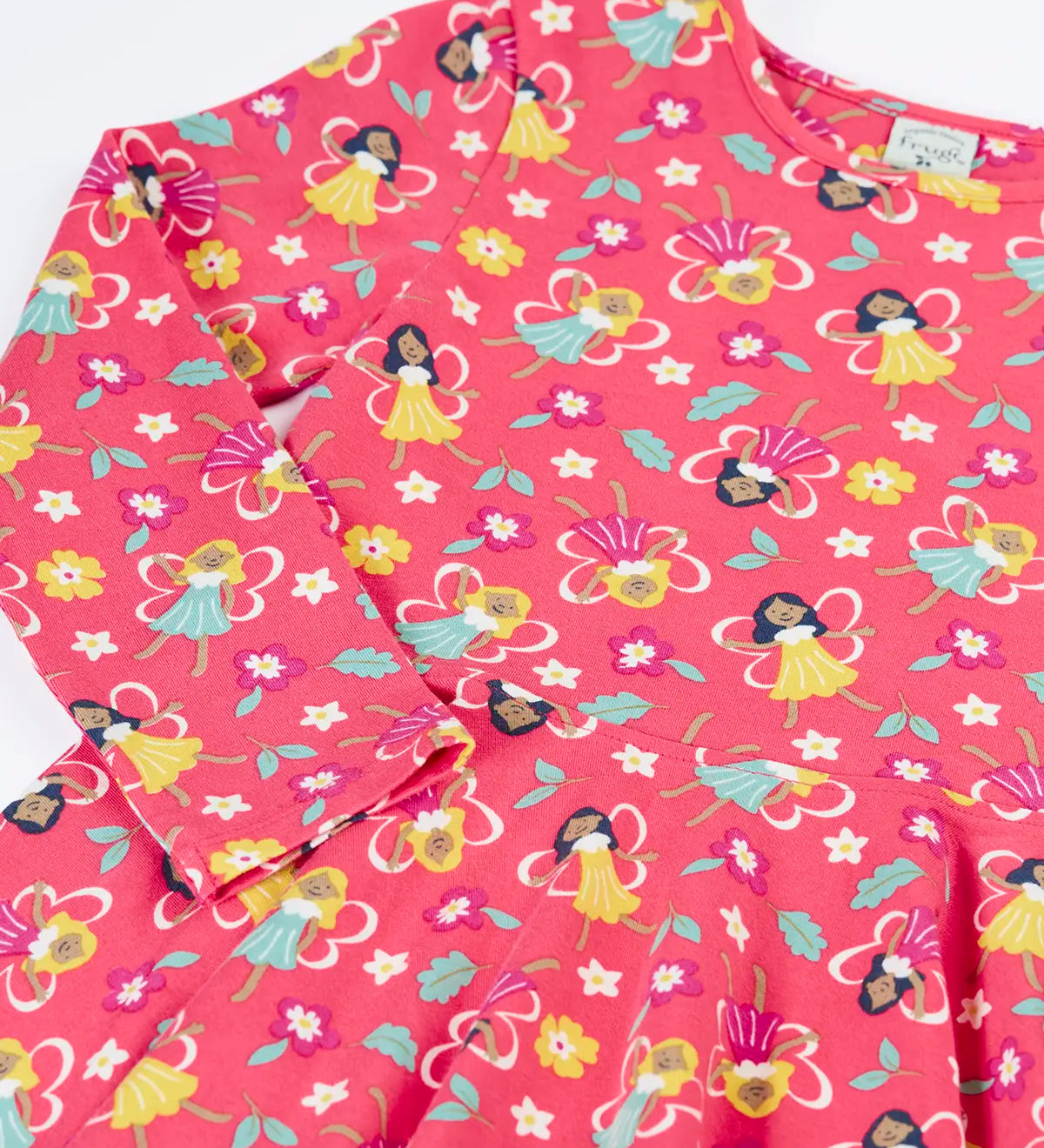 Close up of the Frugi GOTS organic cotton long sleeved sofia skater dress in fairy flutter. Pink background with colourful fairy print featuring flowers and leaves.