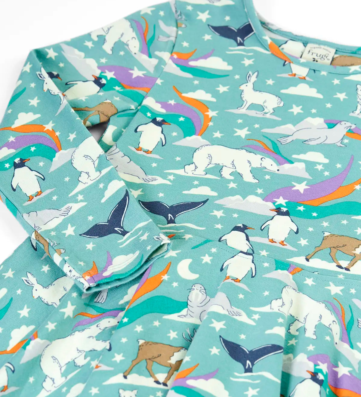 Close up of the Frugi GOTS organic cotton long sleeved sofia skater dress in polar aurora. Blue background with and all over print featuring artic animals among star and colourful swishes. 