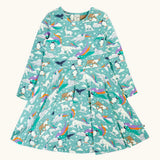 Frugi GOTS organic cotton sofia skater dress in polar aurora. Blue green background with and all over print featuring polar animals among star and colourful swishes. 