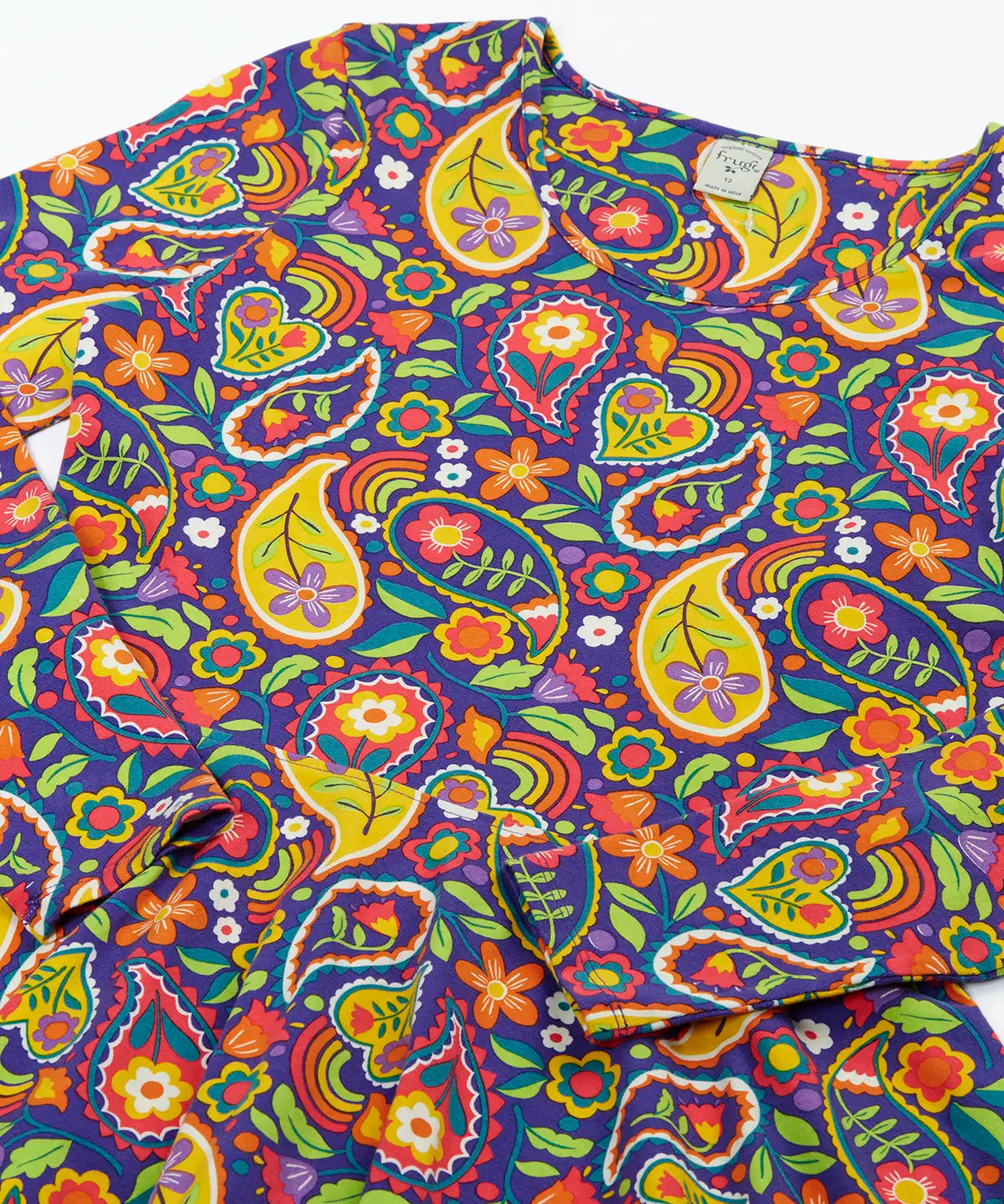 Close up of the details on the Frugi GOTS organic cotton sofia skater dress in pretty paisley. Purple background with colourful paisley print featuring floral and rainbow details.