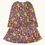 Frugi GOTS organic cotton sofia skater dress in pretty paisley. Purple background with colourful paisley print featuring flower and rainbow details.