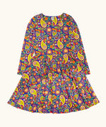 Frugi GOTS organic cotton sofia skater dress in pretty paisley. Purple background with colourful paisley print featuring flower and rainbow details.
