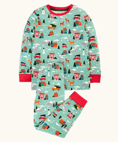 Frugi organic cotton sundown kids long sleeve pyjama set with a winter drives print. Light green long sleeved pyjama top and matching trousers featuring an all over repeat print with houses, reindeer, snow topped mountains, fox and stars. 
