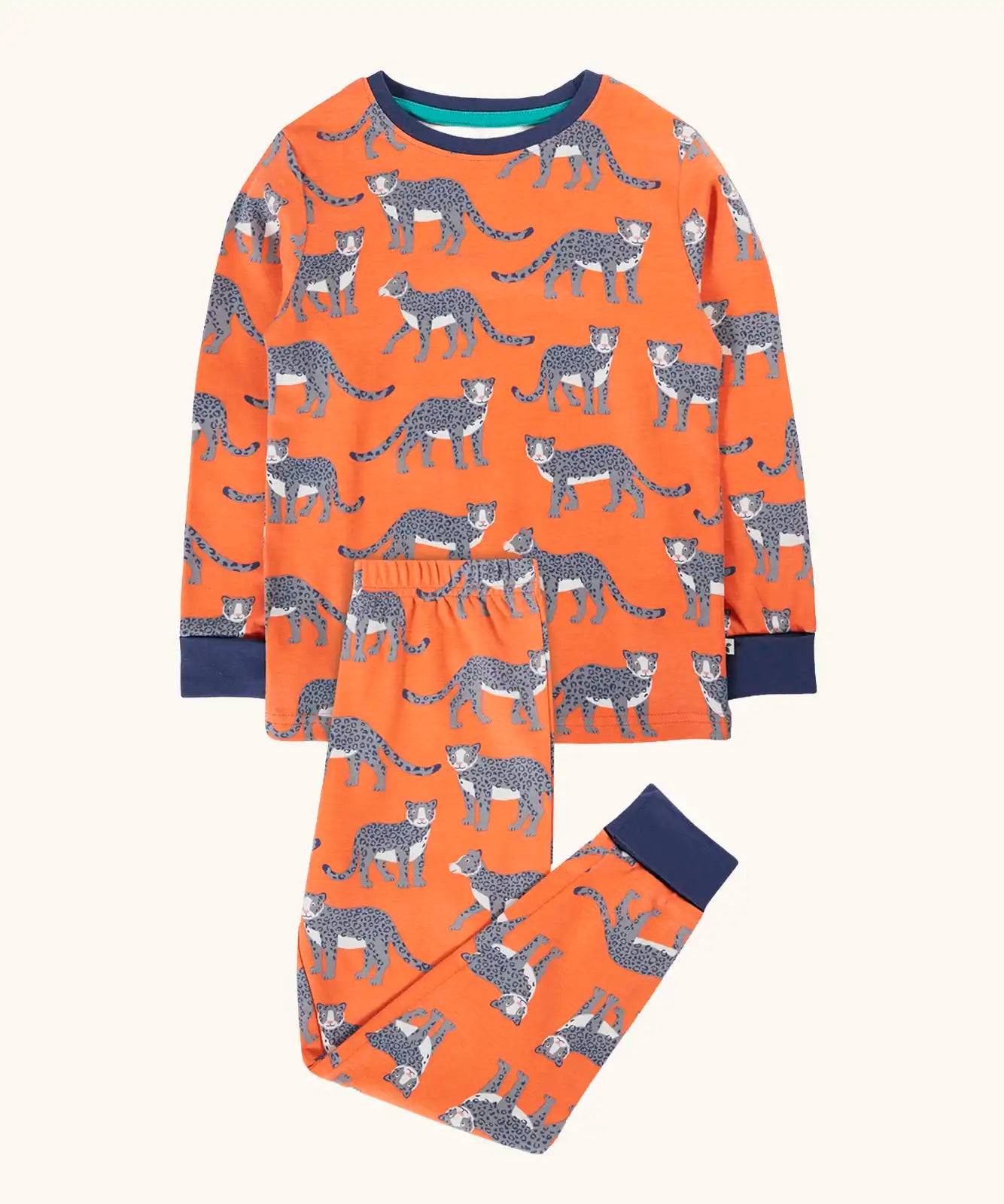 Frugi organic cotton sundown kids long sleeve pyjama set with a leopard leap print. Orange long sleeved pyjama top and matching trousers featuring an all over repeat print of grey leopards with navy cuffs and neck trim.