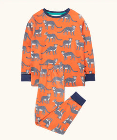 Frugi organic cotton sundown kids long sleeve pyjama set with a leopard leap print. Orange long sleeved pyjama top and matching trousers featuring an all over repeat print of grey leopards with navy cuffs and neck trim.