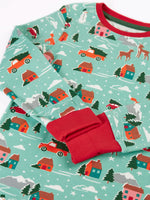 Close up of the red extendable fold over cuffs on the Frugi organic cotton sundown kids long sleeve pyjama set with a winter drives print.