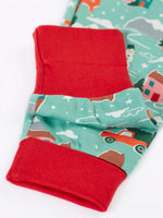Close up of the red contrast extendable cuffs on the Frugi organic cotton sundown long sleeved pyjamas in winter drives print. 