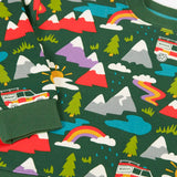 Close up of the rescue trails print on the Frugi organic cotton superb sweatshirt. Bottle green background with colourful snow topped mountains, trees, water, rainbows and a rescue vehicle jeep.
