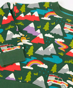Close up of the rescue trails print on the Frugi organic cotton superb sweatshirt. Bottle green background with colourful snow topped mountains, trees, water, rainbows and a rescue vehicle jeep.
