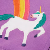 Close up of the unicorn and rainbow appliques on the front of the Frugi organic cotton purple periwinkle carbis zipped children's hoodie. 