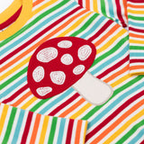 A close up of the red mushroom applique on the front of the Frugi orion long sleeved, rainbow coloured breton striped child's organic cotton top.