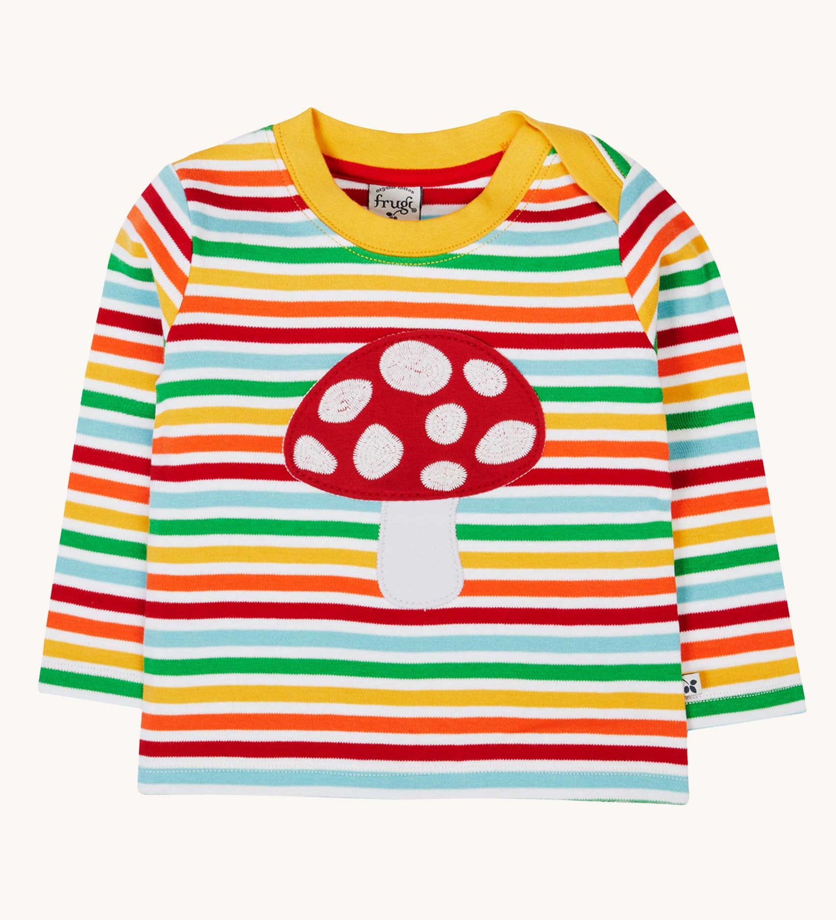 A Frugi orion fun guys applique child's top made from organic cotton. The top has a red mushroom applique on the front, long sleeves and rainbow coloured breton stripes.