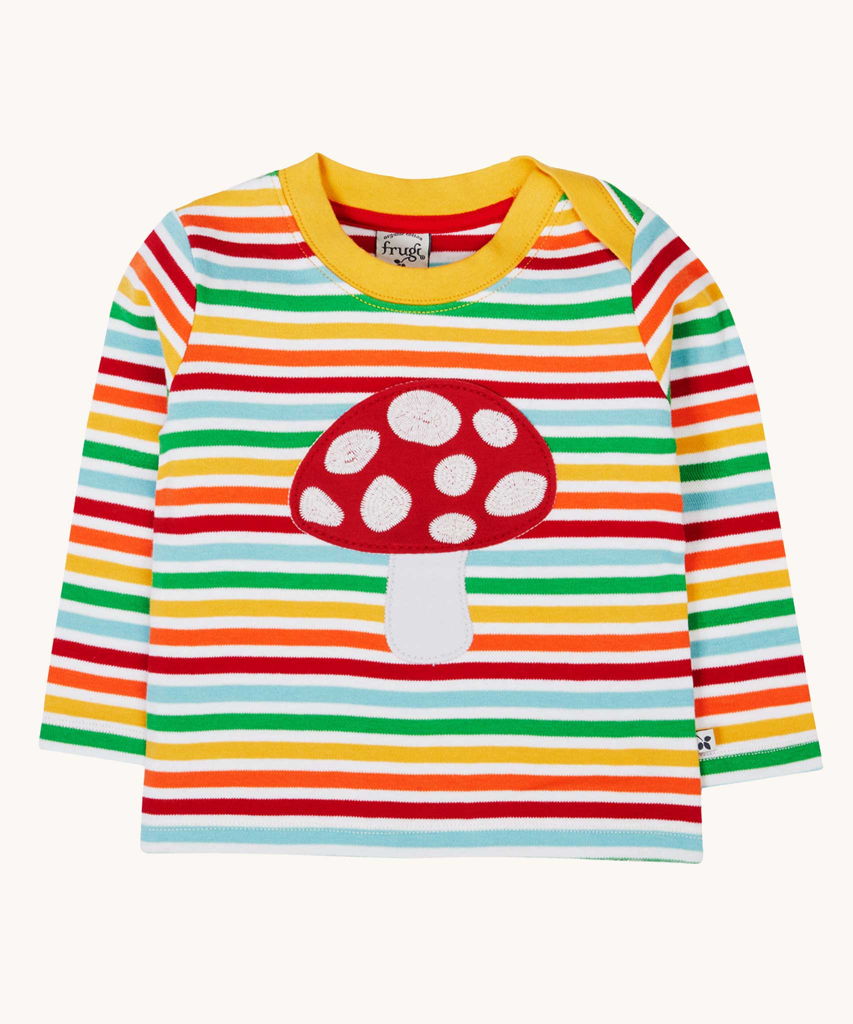 A Frugi orion fun guys applique child's top made from organic cotton. The top has a red mushroom applique on the front, long sleeves and rainbow coloured breton stripes.