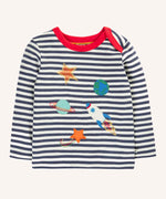 Frugi Orion space applique long sleeved organic cotton top on navy stripes with red collar trim. 