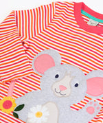 Frugi long sleeve organic cotton top laid flat showing close up of the mouse applique on pink, orange and white striped organic cotton fabric