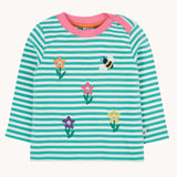 Frugi Orion flowers long sleeved kids top. This organic cotton kids top features a dragon stripe breton stripe background with frour coloured, embroidered flowers and a bee on the front