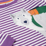 A close up of the wolf applique on the front of the Frugi Otis circular organic cotton violet purple long sleeved stripe top.