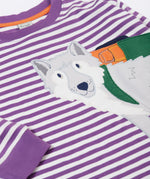 A close up of the wolf applique on the front of the Frugi Otis circular organic cotton violet purple long sleeved stripe top.