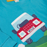 A close up of the red truck applique on the front of the Frugi Organic Cotton Owen Panel Circular Top in a Boat Blue colour with Truck design.
