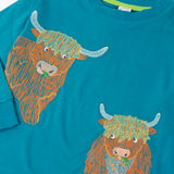 Close up of the details on the highland cow embroidery on the Frugi Owen long sleeve top in boat blue.