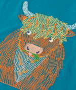 Close up of the details on the highland cow embroidery on the Frugi Owen long sleeve top in boat blue.