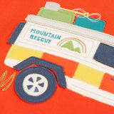 Close up of the white mountain rescue vehicle applique on the Frugi owen children's organic cotton long sleeved orange. 