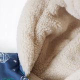  wearing the Frugi Little Penhale Parka - Dream Big/Navy