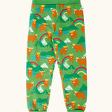 Frugi organic cotton parsnip joggers in palm green with highland coos cow print. 