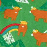 Close up of the cows on the Frugi parsnip joggers in palm green with highland coos cow print. 
