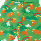 Close up of the Frugi parsnip joggers in palm green with highland coos cow print. 