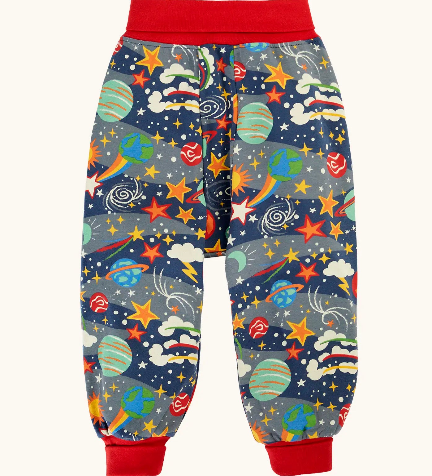 Frugi parsnip pants trousers in a navy with all over explore the stars print and red waist and leg cuffs. 