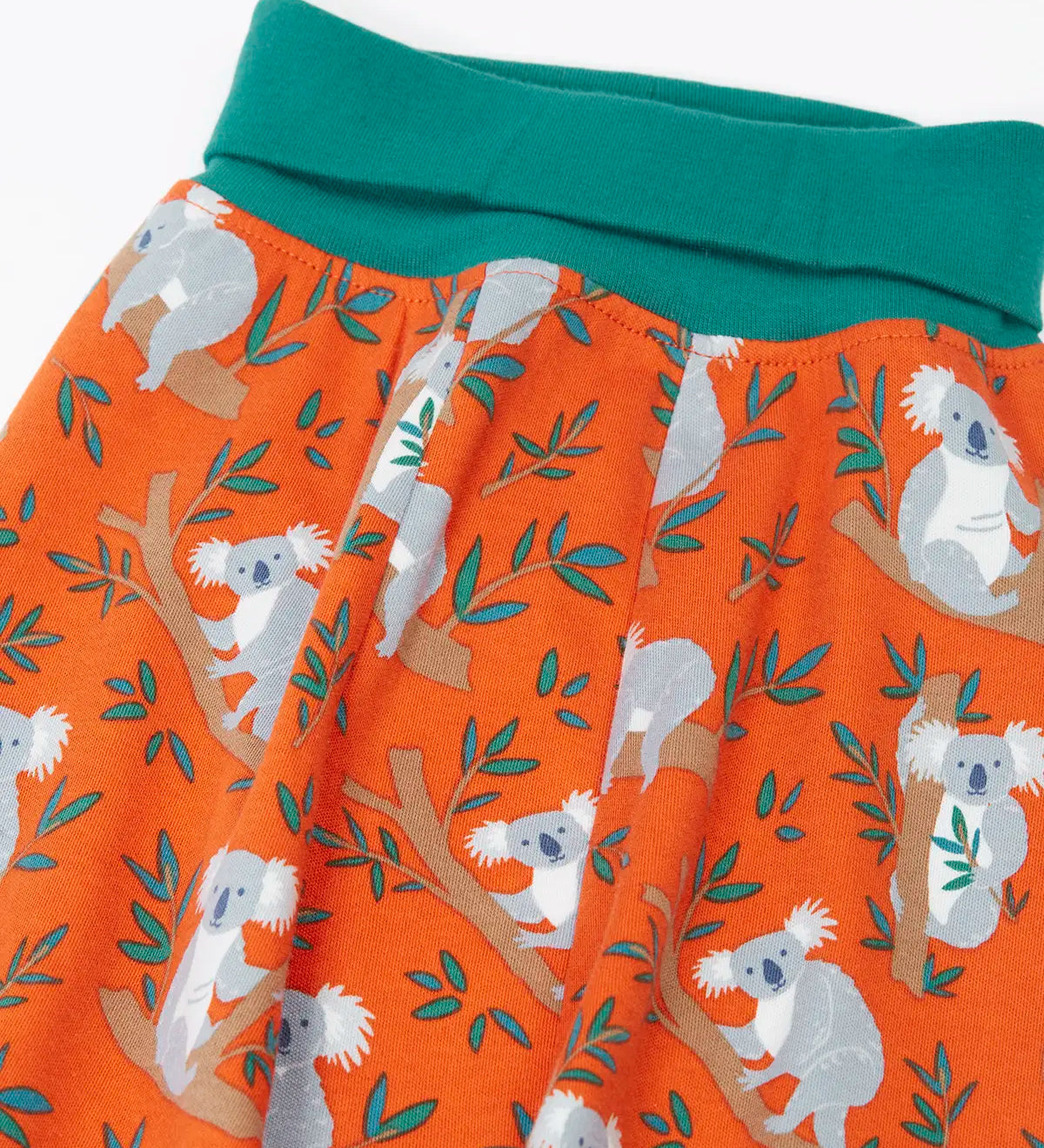 Frugi GOTS organic cotton parsnip pants in orange with a repeating koala  print and a teal elasticated waistband for extender wear