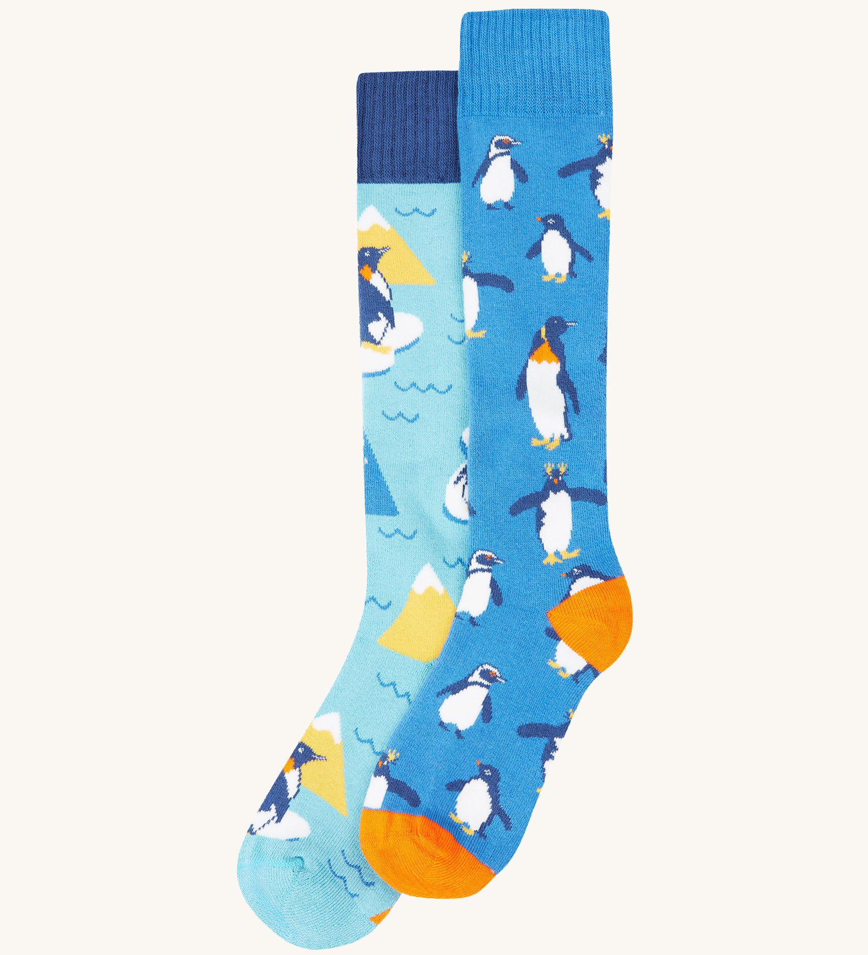 Frugi penguin brilliant boot sock 2 pack - GOTS organic cotton high socks in light and dark blue with different penguins. Features a light elasticated cuff for a snug fit