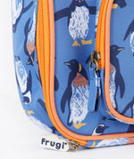 A close up of the Frugi kids pack a lunch bag in penguin waddle. Showing the orange trim and zip detail 